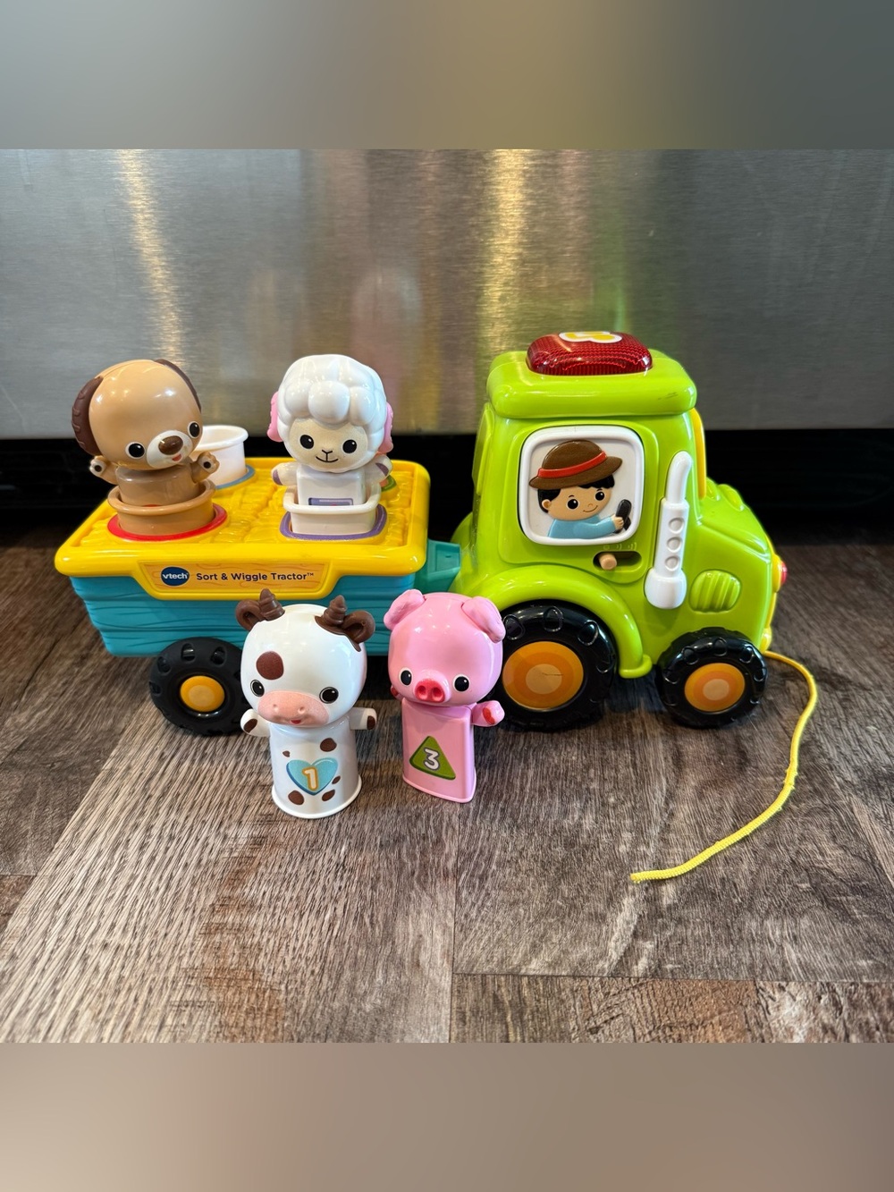 VTech Sort & Wiggle Tractor with Farm Animals Toy Shape Sorting Music and Sounds